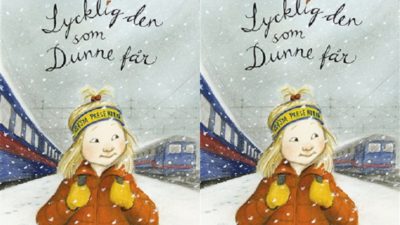 Omslaget till boken. På omslaget står ett barn med röd jacka, gult pannband och långt blont hår. I bakgrunden syns röda och blå tåg.